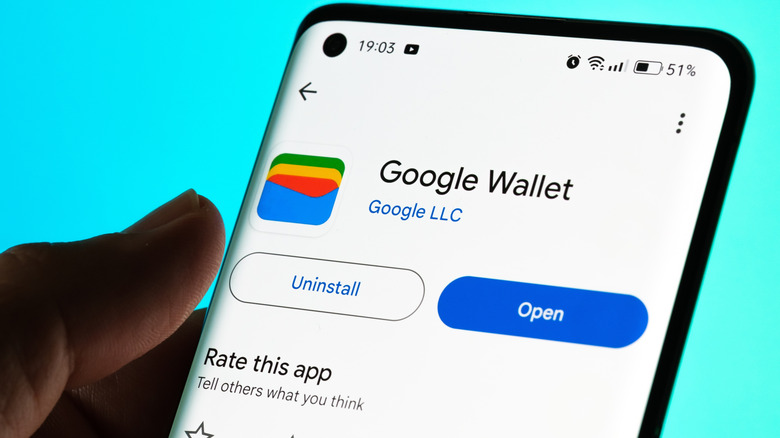 Google Wallet page in the Google Play Store with blue open button.