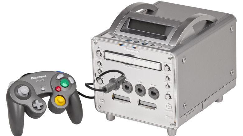 A Panasonic Q GameCube console with a controller plugged in against a white background
