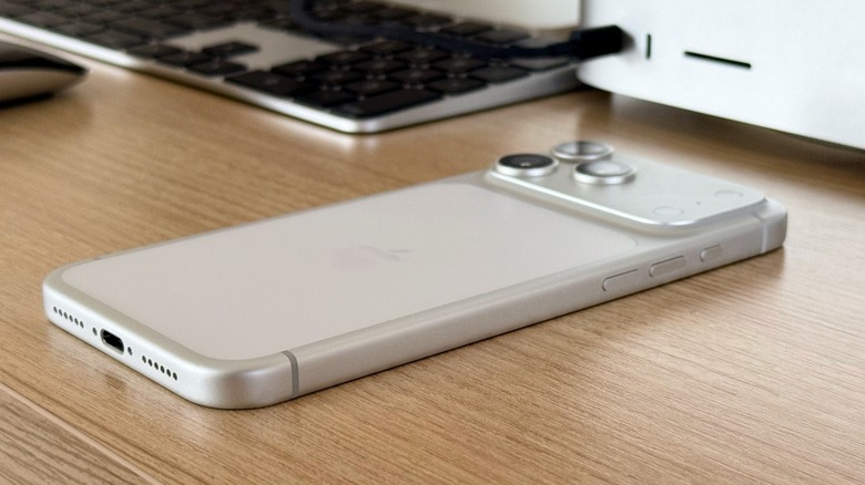 An iPhone 17 Pro Max on a desktop