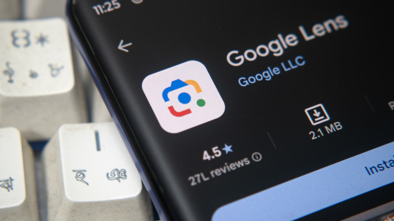 A Google Lens app listing open on a smartphone beside a computer keyboard.