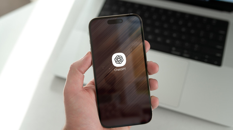 The ChatGPT app icon on a smartphone's display.