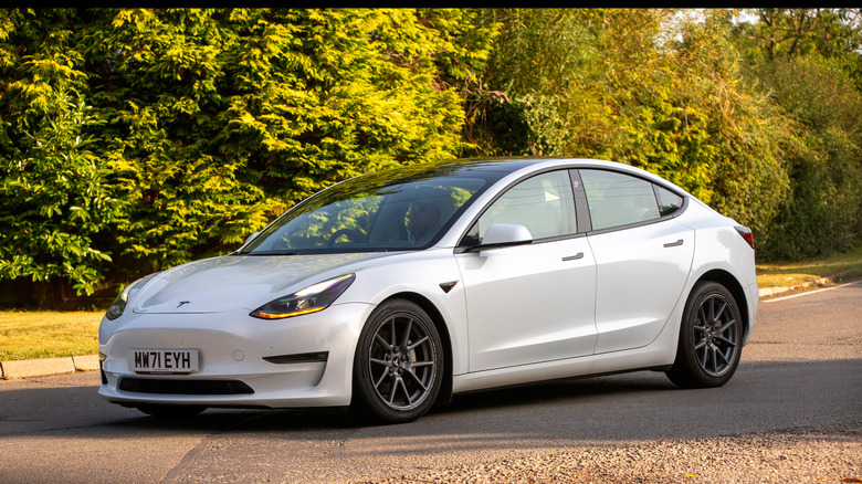 2021 Tesla Model 3 long range electric car parked on a British country road