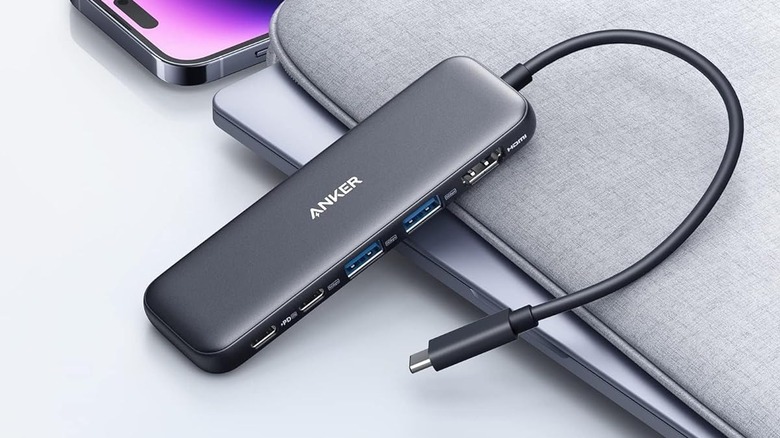 The Anker USB-C Hub 5-in-1 resting on top of a laptop sleeve.