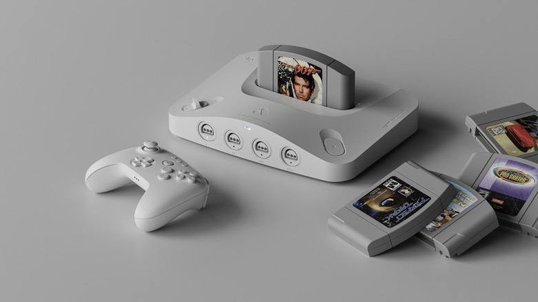 Analogue 3D in White with 007 Goldeneye Cartridge inserted alongside four other Nintendo 64 games.