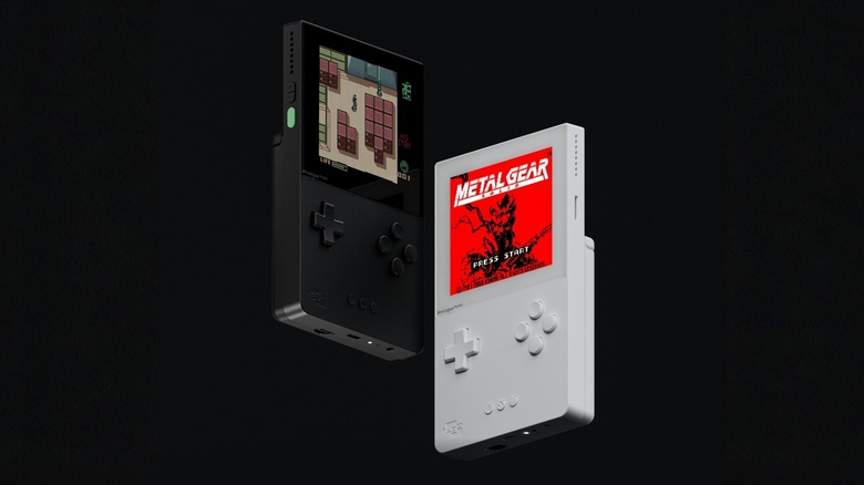 Analogue pocket in black and white running Metal Gear: Ghost Babel for Game Boy Color