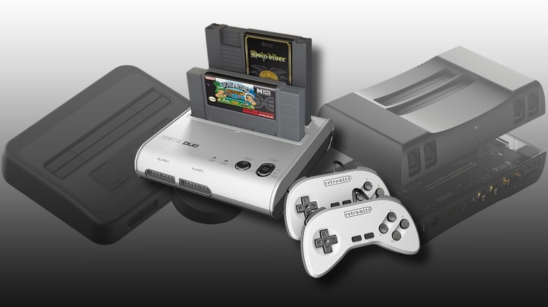 Transparent Analogue Nt Super Nt (left) and Mini mini (right) with a Retro-Bit Retro Duo 2 in 1 in the foreground.