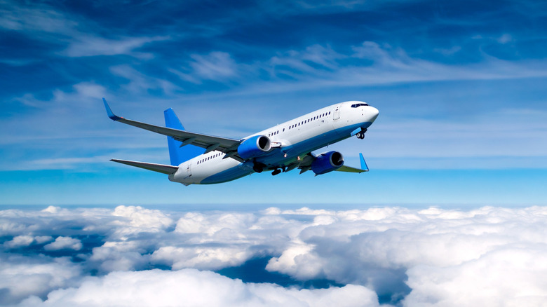 An airplane flying over the clouds