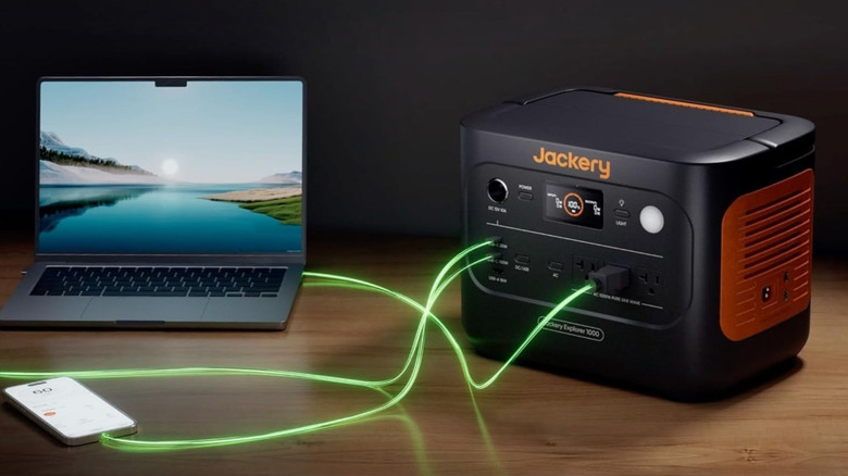 The Jackery Explorer 100 v2 charging a laptop and phone