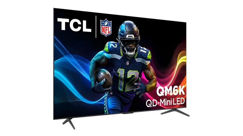 TCL QM6K at a side angle displaying a NFL player on a white background.