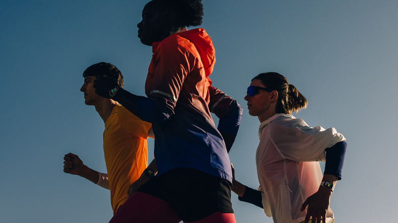 Three people running, all wearing an Apple Watch Series 11.