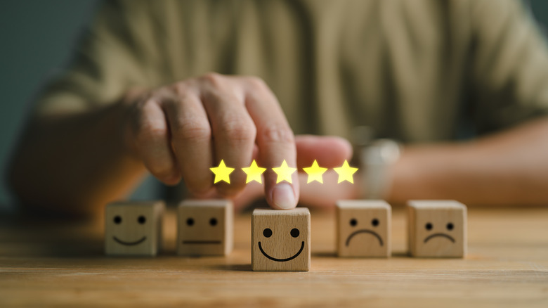 A person selecting the best cube from a list