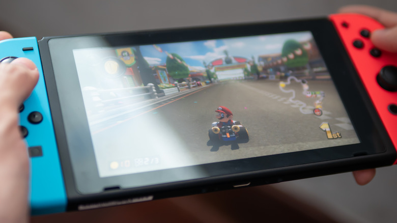 A person playing on a Nintendo Switch console.