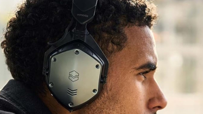 A man wearing the V-200 M-200 headphones.