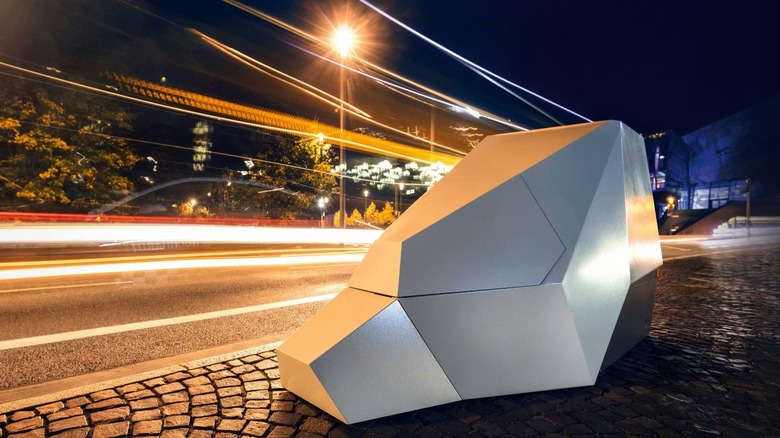 Vitronic Poliscan Enforcement Trailer on the side of the road with nighttime views.
