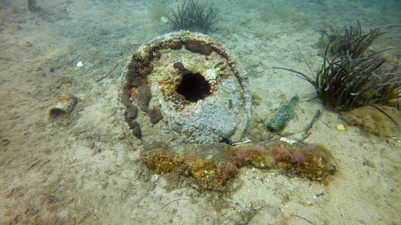 Rusted barrel at the bottom of the ocean.