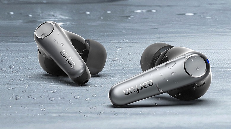 EarFun Air Pro 3 wireless earbuds with visible moisture.