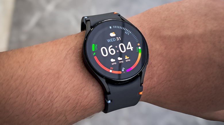 Samsung Galaxy Watch FE on wrist displaying the time