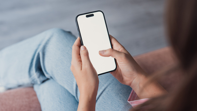A person adjusting settings on a phone