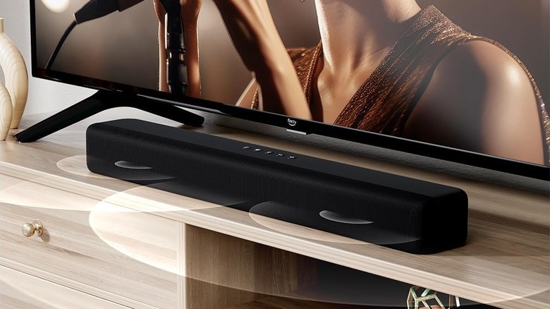 The Amazon Fire TV Soundbar set up below a tabletop TV.