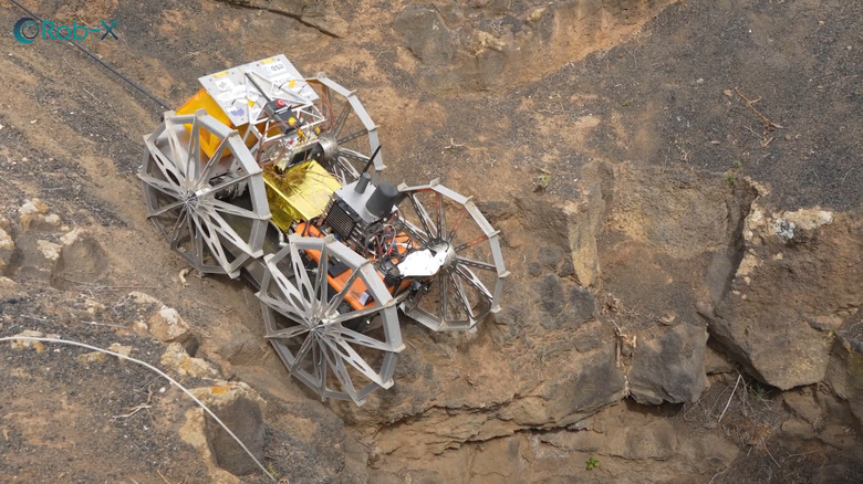close-up of coyote iii robot as it rappels down into a cave to explore it