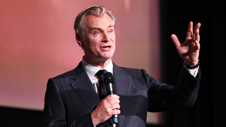 Christopher Nolan on a microphone