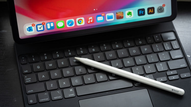 Apple Pencil being used by an iPad user for productivity and drawing.