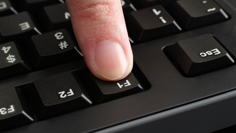 Pressing the F1 key on a keyboard