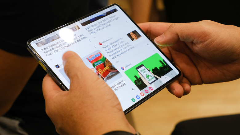 Someone using a foldable phone.
