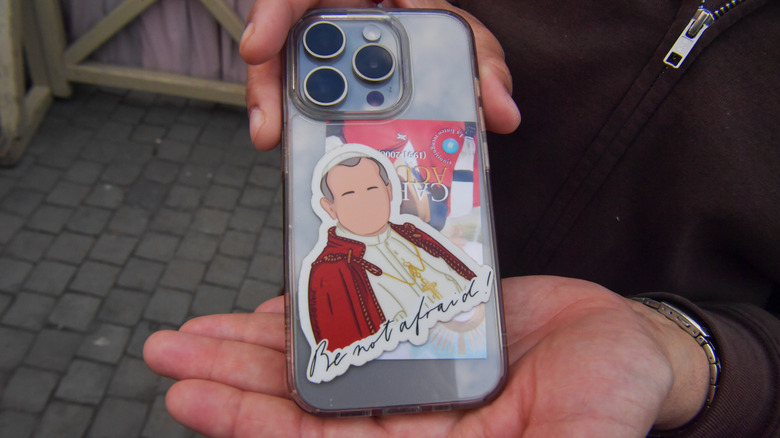 Pope sticker on an iPhone
