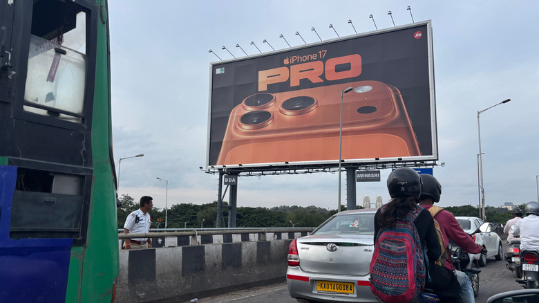 An iPhone 17 Pro billboard in India.