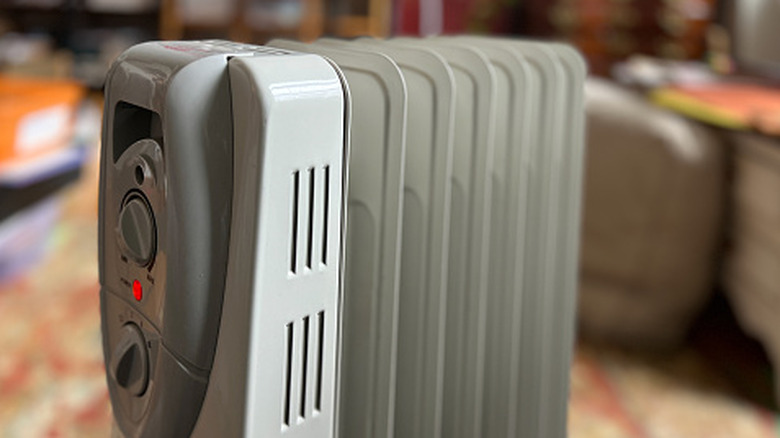 A radiator heater in a room.