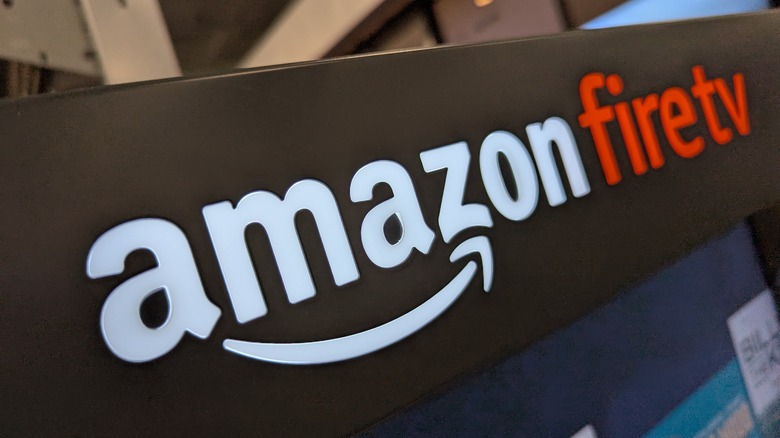 The Amazon Fire TV logo above a store display.