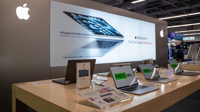 Apple MacBook Air laptops on display inside a store