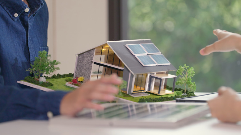 Model of home with solar panels on top