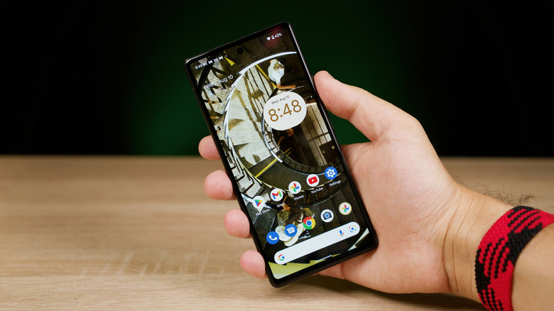 A hand holding a Google Pixel phone