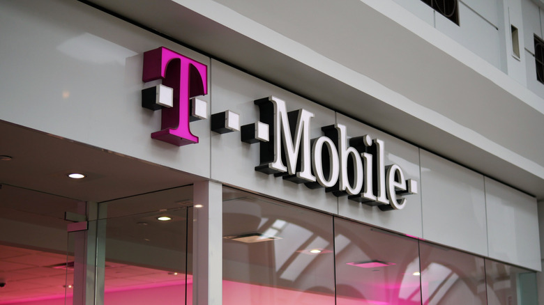 A T-Mobile logo hanging above a T-Mobile store.