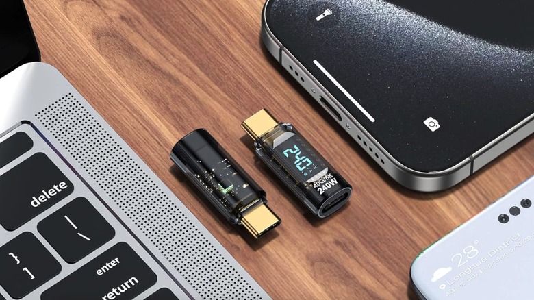 Two 240W USB C Adapter Power Meter Testers between an iPhone and a MacBook.