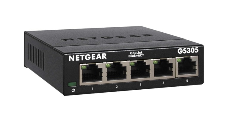 Netgear GS305 network switch with extra Ethernet ports visible.