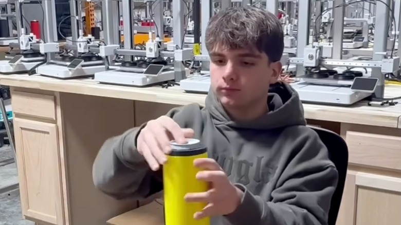Mike Satterlee testing one of his can coolers.
