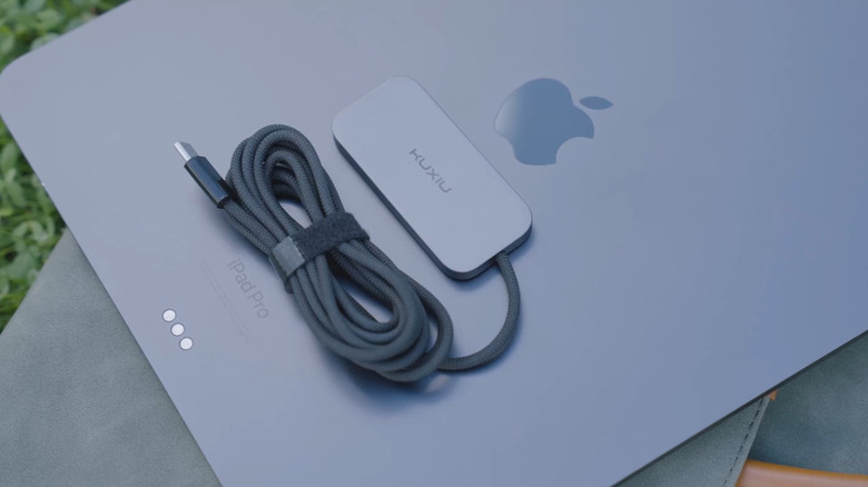 Ku Xiu Magnetic Wireless Charger on top of iPad Pro