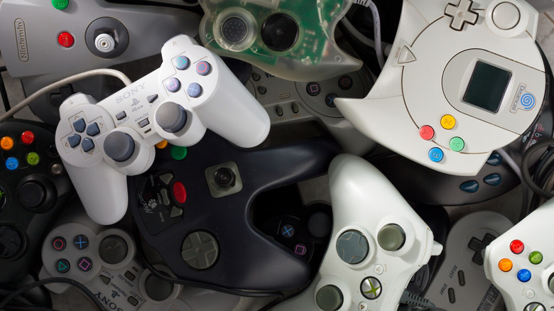 Controllers from several different consoles all piled together