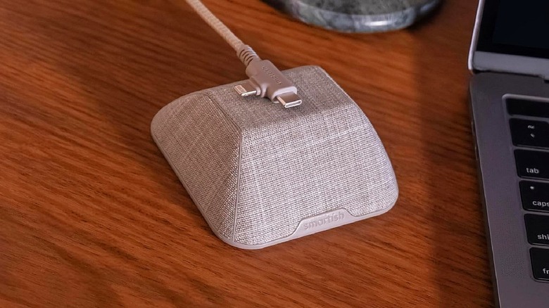 Smartish magnetic cable holder in toasted beige color with cable resting on top.