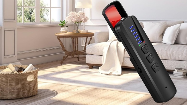 Dronewing hidden spy camera finder with multi-tools in living room.