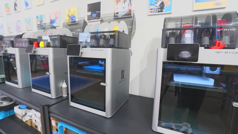 Unnecessary Inventions printing a 3D-printed suitcase with Bambu Lab H2C printers