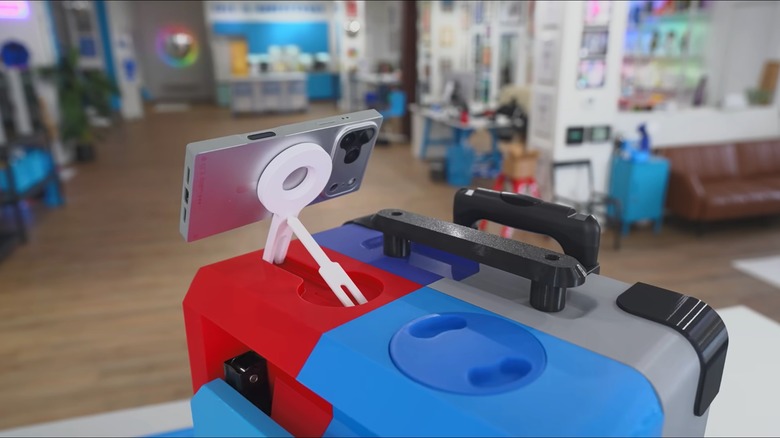 Unnecessary Inventions 3D-printed suitcase with smartphone attached to mag-safe phone mount