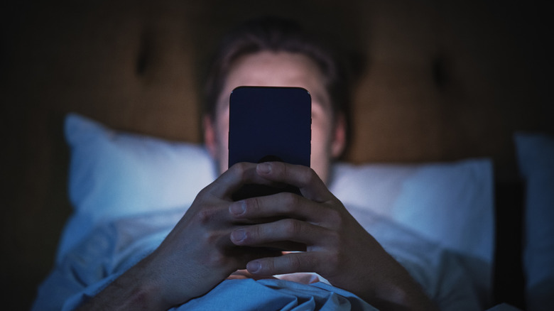 Person staring at smartphone
