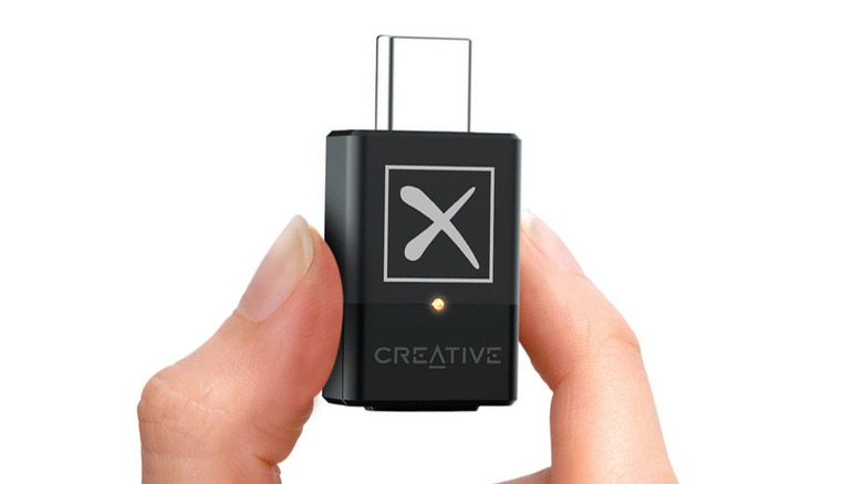Creative BT-W5 being held by a person on a white background