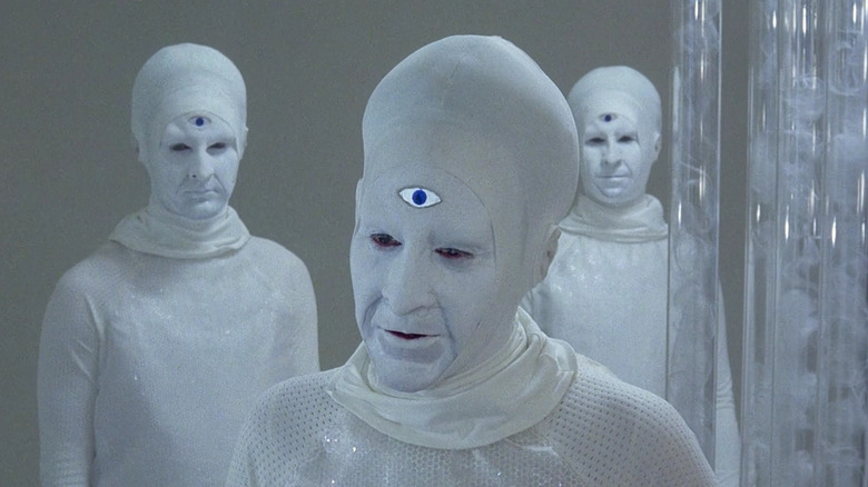 Three Akirians dressed in white
