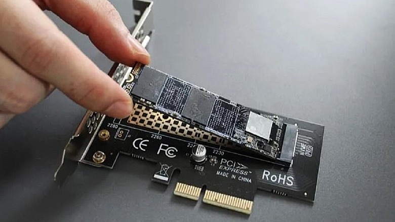 Glotrends PA09-HS M.2 NVMe to PCIe 4.0 X4 Adapter being installed.