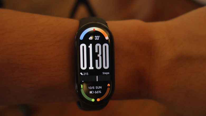 a Xiaomi Smart Band on a person's wrist